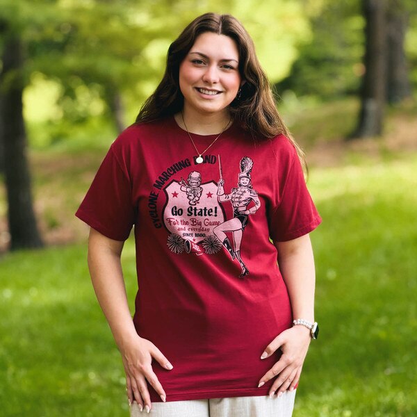 A student wearing Comfort Wash Marching Band Cy Cardinal Short Sleeve T-Shirt
